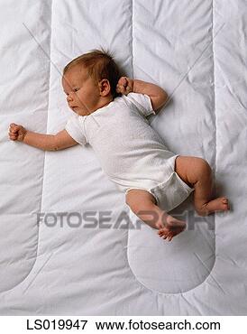 Picture - portrait of a 
baby girl from 
above. fotosearch 
- search stock 
photos, pictures, 
images, and photo 
clipart