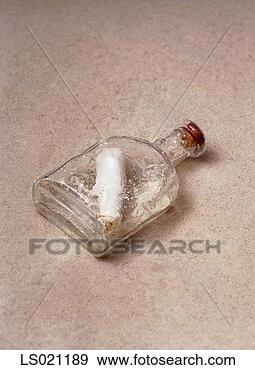 Stock Photograph - message scrolled 
in a bottle. fotosearch 
- search stock 
photos, pictures, 
images, and photo 
clipart