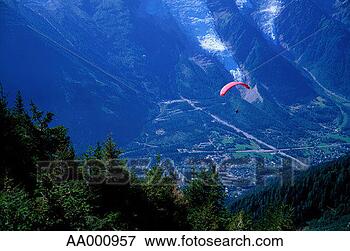 Picture - person paragliding 
in the french 
alps. fotosearch 
- search stock 
photos, pictures, 
images, and photo 
clipart