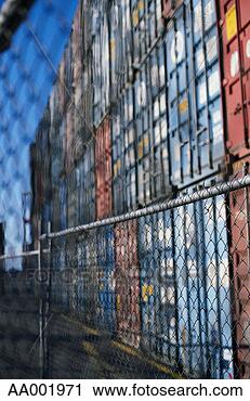 Stock Photography - shipping containers 
behind a chain-link 
fence. fotosearch 
- search stock 
photos, pictures, 
images, and photo 
clipart