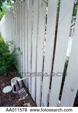 Stock Photo - paint can and 
paintbrush beside 
a fence. fotosearch 
- search stock 
photos, pictures, 
images, and photo 
clipart