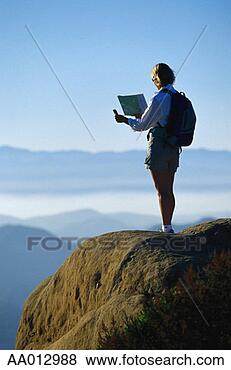 Stock Photo - woman using a 
map and compass 
to navigate. fotosearch 
- search stock 
photos, pictures, 
images, and photo 
clipart