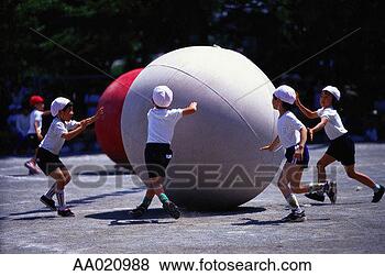 Stock Photo - elementary students 
rolling balls 
in a schoolyard. 
fotosearch - search 
stock photos, 
pictures, images, 
and photo clipart