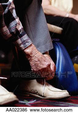 Stock Photo - man tying his 
bowling shoes. 
fotosearch - search 
stock photos, 
pictures, images, 
and photo clipart