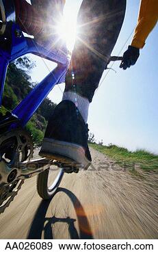 Stock Photograph - man riding mountain 
bike. fotosearch 
- search stock 
photos, pictures, 
images, and photo 
clipart