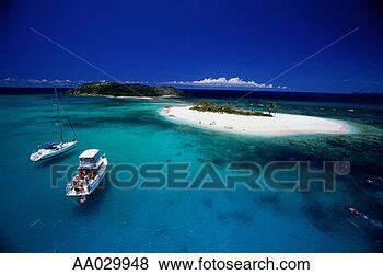 Stock Photo - two leisure boats 
off a caribbean 
island. fotosearch 
- search stock 
photos, pictures, 
images, and photo 
clipart