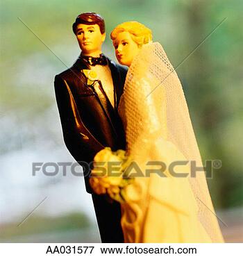 Picture - bride and groom 
wedding cake figurines. 
fotosearch - search 
stock photos, 
pictures, images, 
and photo clipart