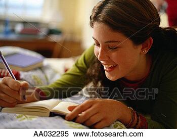 Stock Image - teenage girl writing 
in a journal. 
fotosearch - search 
stock photos, 
pictures, images, 
and photo clipart