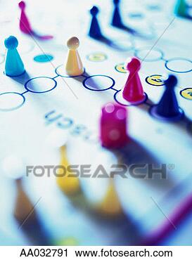 Stock Photography - game pieces on 
a board game. 
fotosearch - search 
stock photos, 
pictures, images, 
and photo clipart