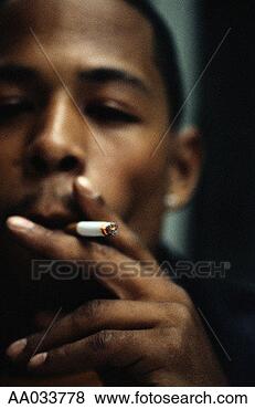 Stock Photo - young man smoking. 
fotosearch - search 
stock photos, 
pictures, images, 
and photo clipart