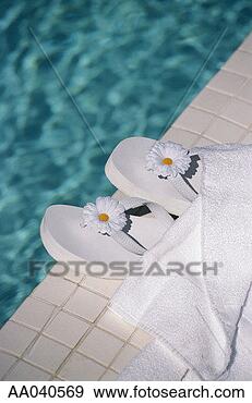 Stock Photograph - flip-flops by 
swimming pool. 
fotosearch - search 
stock photos, 
pictures, images, 
and photo clipart