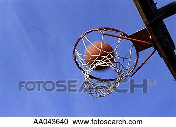 Stock Photography - basketball going 
through hoop. 
fotosearch - search 
stock photos, 
pictures, images, 
and photo clipart