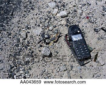 Stock Photograph - broken mobile 
phone left on 
gravel. fotosearch 
- search stock 
photos, pictures, 
images, and photo 
clipart