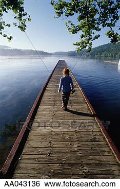 Stock Photo - girl with fishing 
rod, walking along 
pier. fotosearch 
- search stock 
photos, pictures, 
images, and photo 
clipart