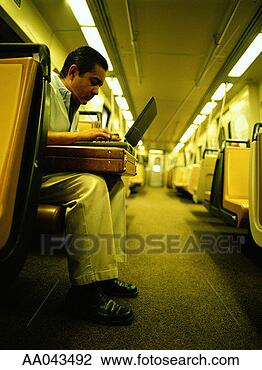 Stock Photo - man using laptop 
on subway. fotosearch 
- search stock 
photos, pictures, 
images, and photo 
clipart