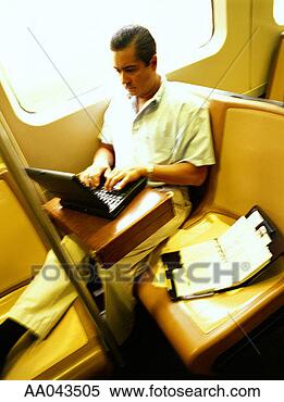 Stock Image - man using laptop 
on subway. fotosearch 
- search stock 
photos, pictures, 
images, and photo 
clipart
