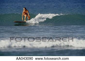 Stock Photography - young woman surfing, 
hawaii. fotosearch 
- search stock 
photos, pictures, 
images, and photo 
clipart