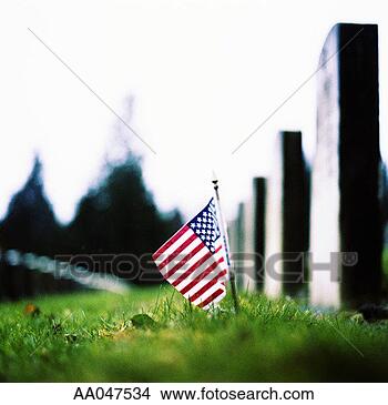 Stock Photo - american flag 
in front of tombstone. 
fotosearch - search 
stock photos, 
pictures, images, 
and photo clipart