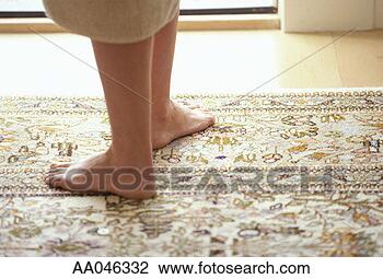 Stock Photo - bare feet on rug. 
fotosearch - search 
stock photos, 
pictures, images, 
and photo clipart