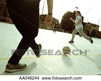 Stock Photo - boys kicking soccer 
ball. fotosearch 
- search stock 
photos, pictures, 
images, and photo 
clipart