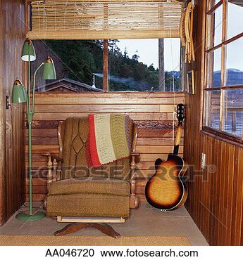 Stock Photography - chair and guitar 
next to window. 
fotosearch - search 
stock photos, 
pictures, images, 
and photo clipart