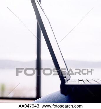Stock Photo - close-up of laptop 
in residence. 
fotosearch - search 
stock photos, 
pictures, images, 
and photo clipart