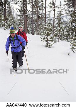 Stock Photography - couple backcountry 
cross country 
skiing. fotosearch 
- search stock 
photos, pictures, 
images, and photo 
clipart