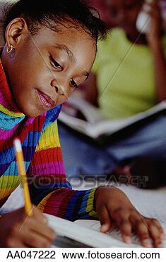 Stock Photo - girl doing homework. 
fotosearch - search 
stock photos, 
pictures, images, 
and photo clipart