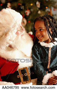 Stock Image - little girl sitting 
on santa's lap. 
fotosearch - search 
stock photos, 
pictures, images, 
and photo clipart