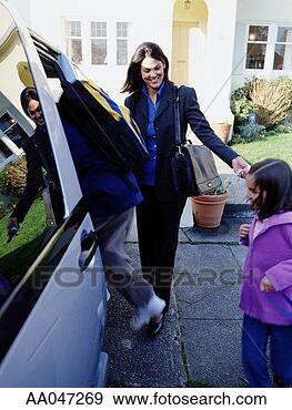 Stock Photograph - mother helps children 
into mini van. 
fotosearch - search 
stock photos, 
pictures, images, 
and photo clipart