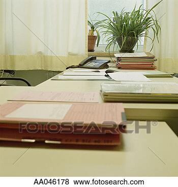 Stock Photo - organized desk 
with stacks of 
paperwork. fotosearch 
- search stock 
photos, pictures, 
images, and photo 
clipart