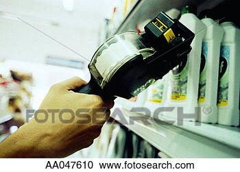 Stock Photography - pricing items 
with pricing gun. 
fotosearch - search 
stock photos, 
pictures, images, 
and photo clipart