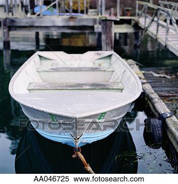 Stock Image - rowboat docked 
near pier. fotosearch 
- search stock 
photos, pictures, 
images, and photo 
clipart