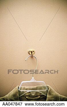 Picture - shirt hanging 
on hook in department 
store fitting 
room. fotosearch 
- search stock 
photos, pictures, 
images, and photo 
clipart