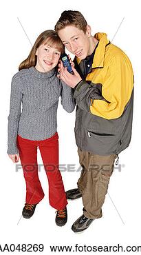 Stock Photograph - teenagers listening 
to mobile phone. 
fotosearch - search 
stock photos, 
pictures, images, 
and photo clipart