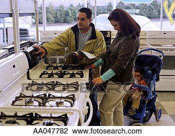 Stock Photo - young family shopping 
for a gas stove 
at an appliance 
store. fotosearch 
- search stock 
photos, pictures, 
images, and photo 
clipart