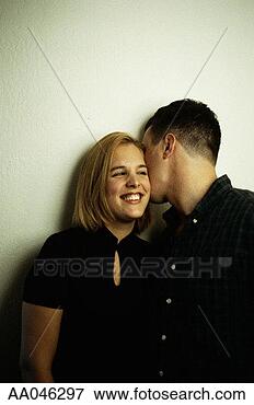 Picture - young man kissing 
young woman. fotosearch 
- search stock 
photos, pictures, 
images, and photo 
clipart