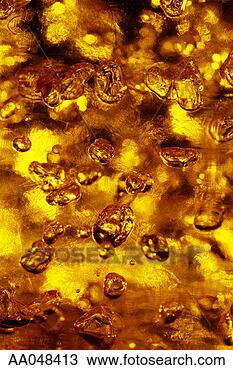 Stock Photo - bubbles in gold 
liquid. fotosearch 
- search stock 
photos, pictures, 
images, and photo 
clipart