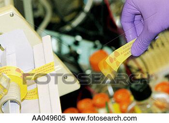 Stock Image - gloved hand of 
lab technician 
pulling piece 
of radioactive 
warning. fotosearch 
- search stock 
photos, pictures, 
images, and photo 
clipart