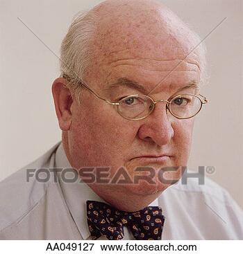 Picture - portrait of a 
disgruntled mature 
businessman. fotosearch 
- search stock 
photos, pictures, 
images, and photo 
clipart