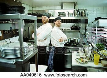 Stock Photo - two chefs standing 
back to back in 
a commerical kitchen. 
fotosearch - search 
stock photos, 
pictures, images, 
and photo clipart