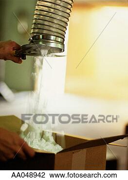 Stock Photo - worker filling 
packing material 
in box. fotosearch 
- search stock 
photos, pictures, 
images, and photo 
clipart