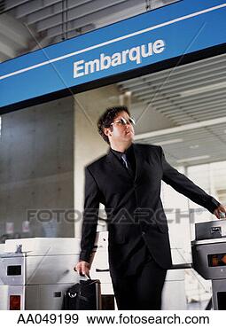 Stock Photograph - young man entering 
train station 
turnstile. fotosearch 
- search stock 
photos, pictures, 
images, and photo 
clipart