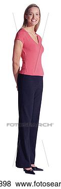 Stock Photo - young woman standing 
with hands behind 
back. fotosearch 
- search stock 
photos, pictures, 
images, and photo 
clipart