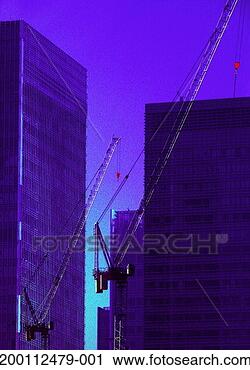 Stock Photography - cranes in front 
of office blocks. 
fotosearch - search 
stock photos, 
pictures, images, 
and photo clipart