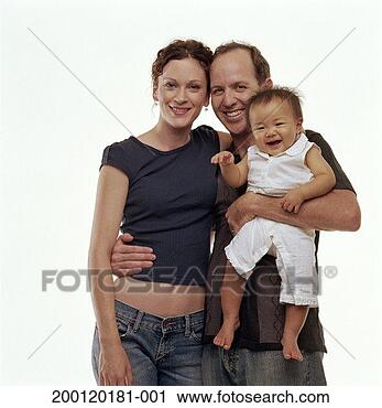 Stock Photography - couple holding 
adopted baby girl 
(9-12 months), 
portrait. fotosearch 
- search stock 
photos, pictures, 
images, and photo 
clipart