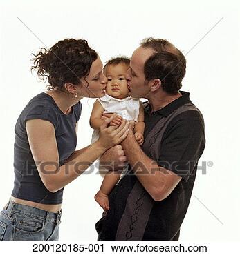 Stock Photography - couple kissing 
checks of adopted 
baby girl (9-12 
months), portrait. 
fotosearch - search 
stock photos, 
pictures, images, 
and photo clipart