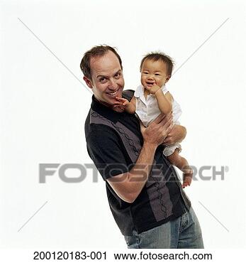 Stock Photography - father holding 
adopted baby girl 
(9-12 months), 
portrait. fotosearch 
- search stock 
photos, pictures, 
images, and photo 
clipart