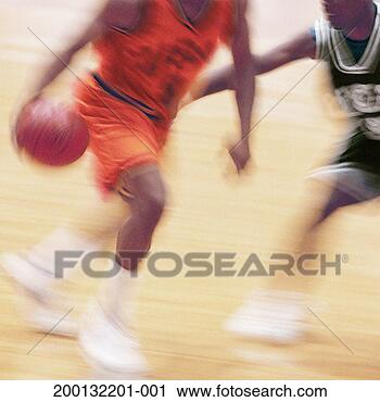 Stock Photography - two men playing 
basketball, low 
section (blurred 
motion). fotosearch 
- search stock 
photos, pictures, 
images, and photo 
clipart