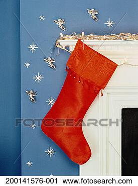 Stock Photography - christmas stocking 
hanging on decorated 
mantelpiece. fotosearch 
- search stock 
photos, pictures, 
images, and photo 
clipart